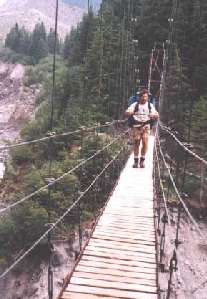 Suspension bridge crossing Tahoma Creek Gorge. One of the wonders of the Wonderland Trail, which circles Mt. Rainier